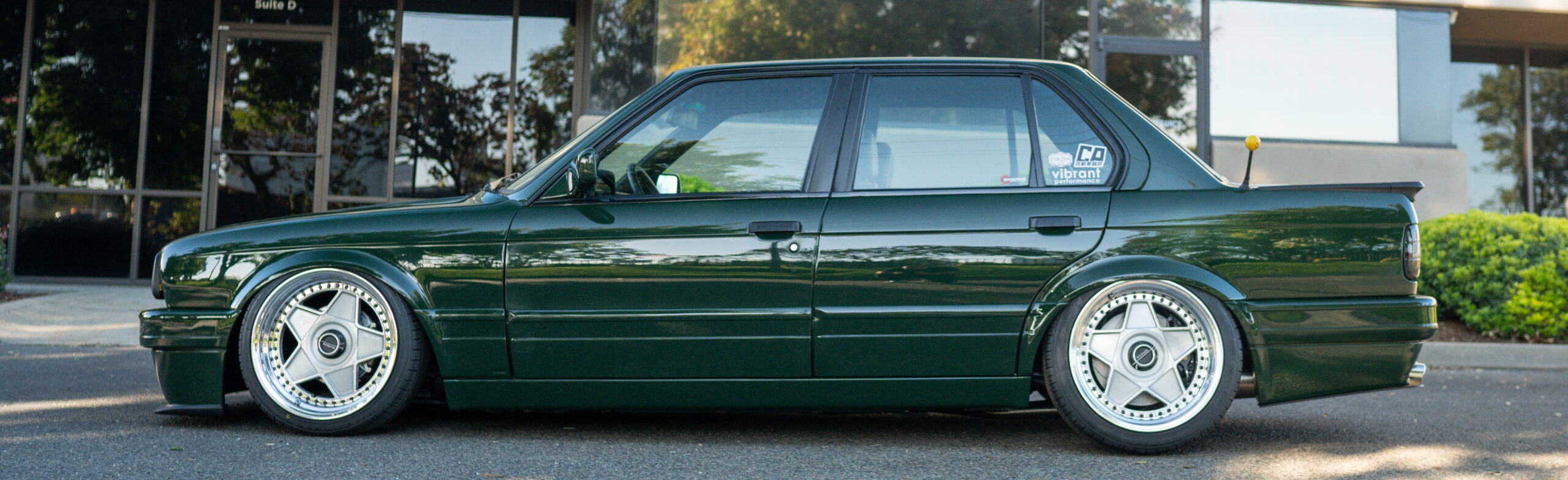 The Greenmaxhine BMW E30 Sedan by CAtuned