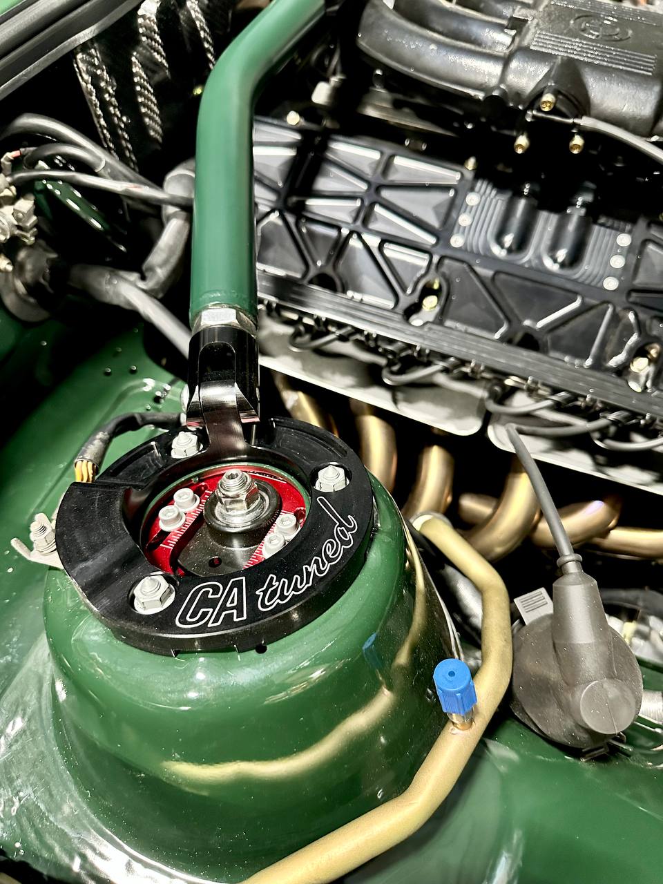 The Greenmaxhine BMW E30 Sedan by CAtuned
